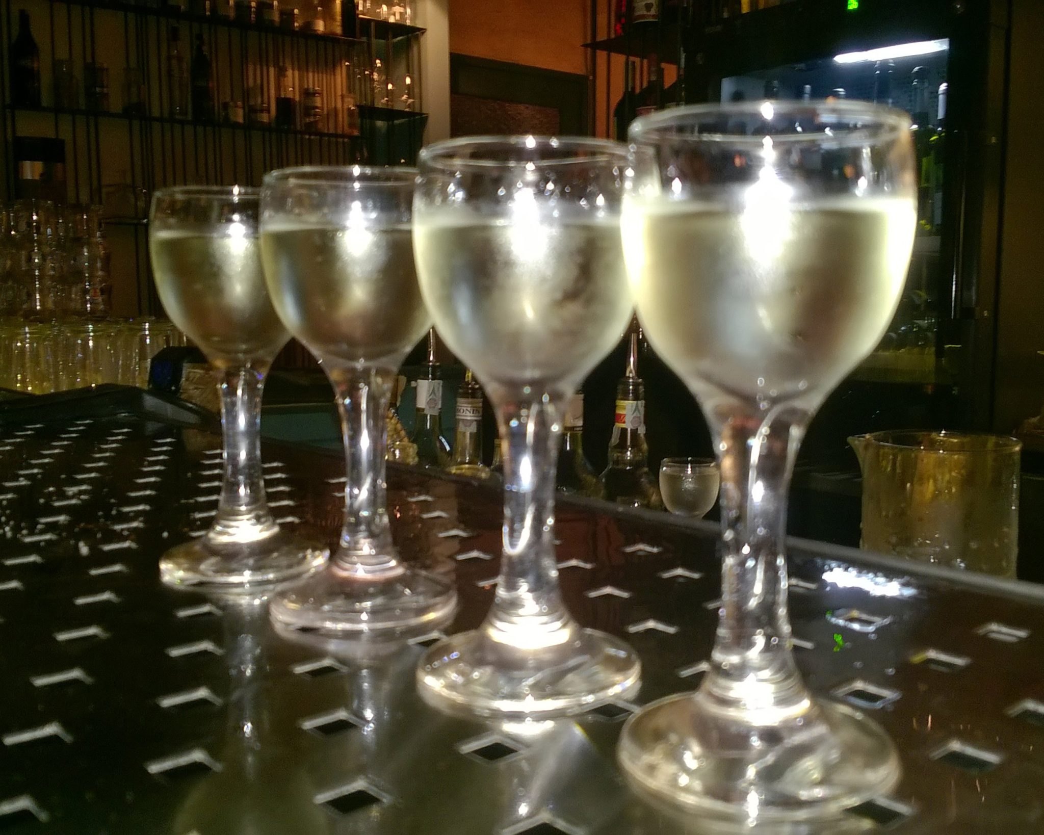 Wine glasses at the bar